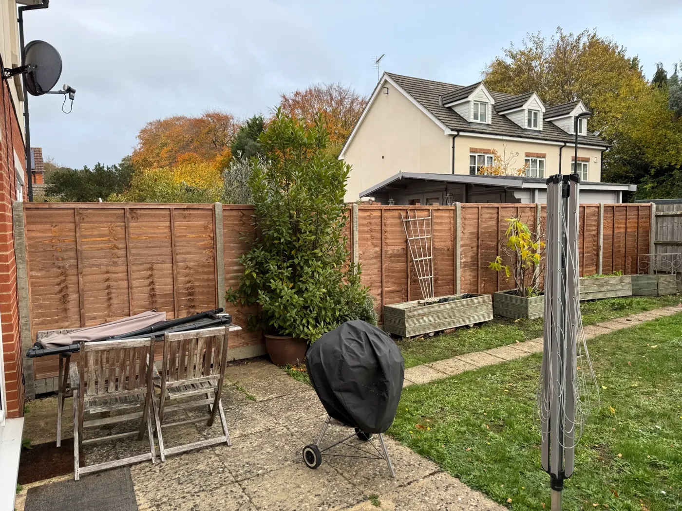 New timber fence installed along a residential garden boundary