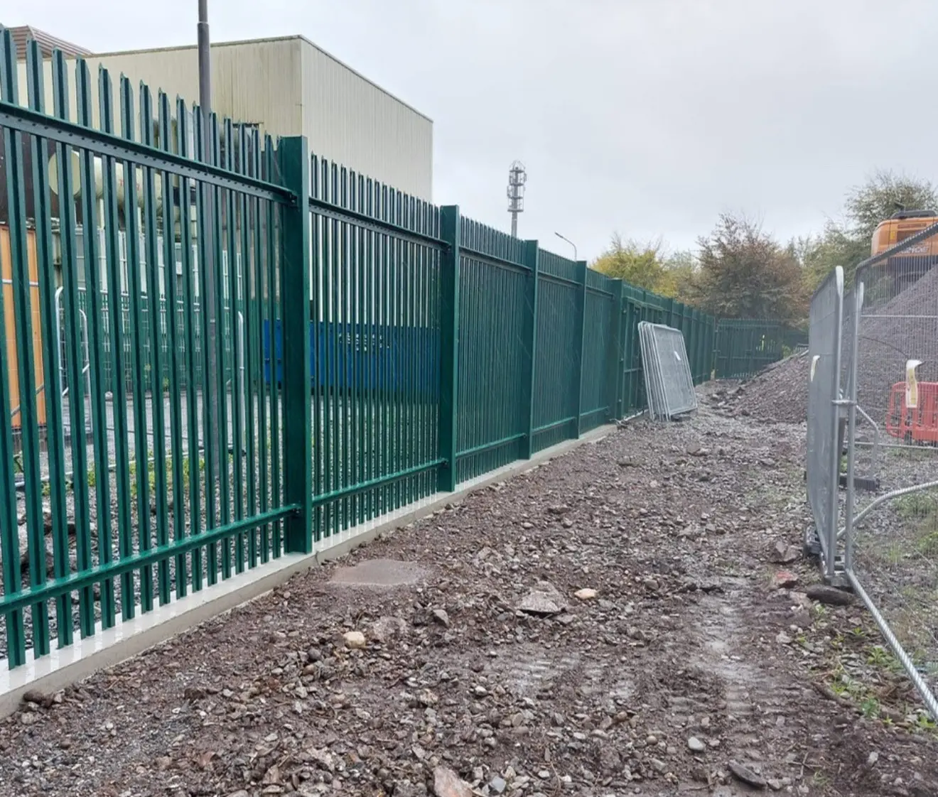 Commercial perimeter fencing installed on a business site