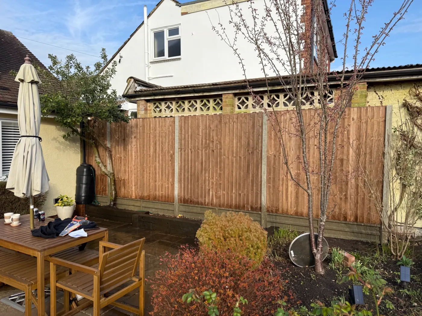 Feather edge fencing and gravel boards behind a patio