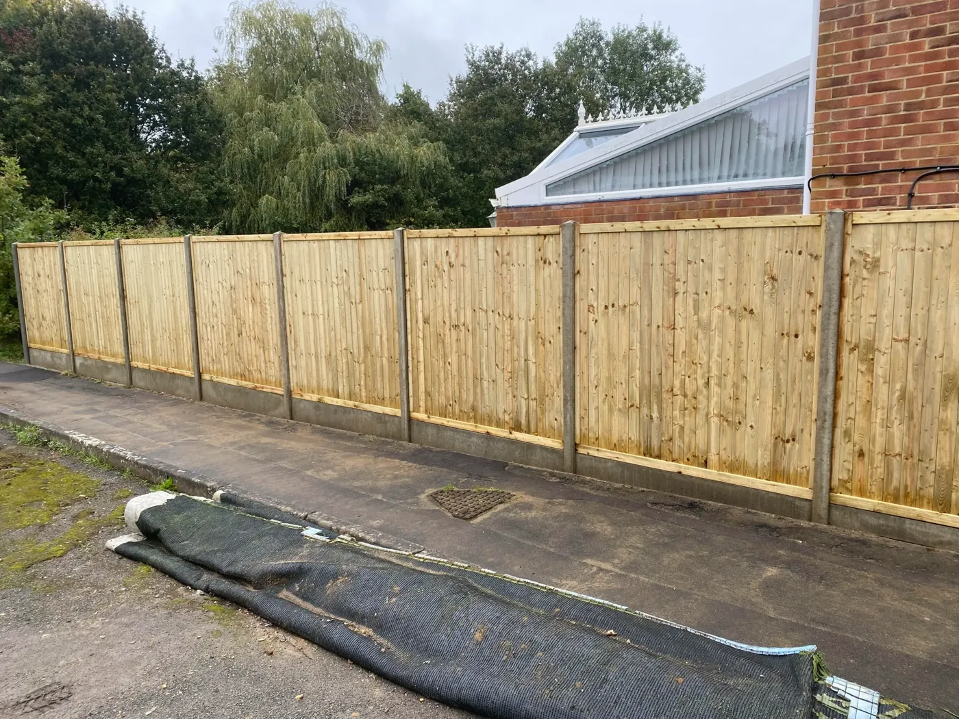 Tongue and groove fence panels fitted